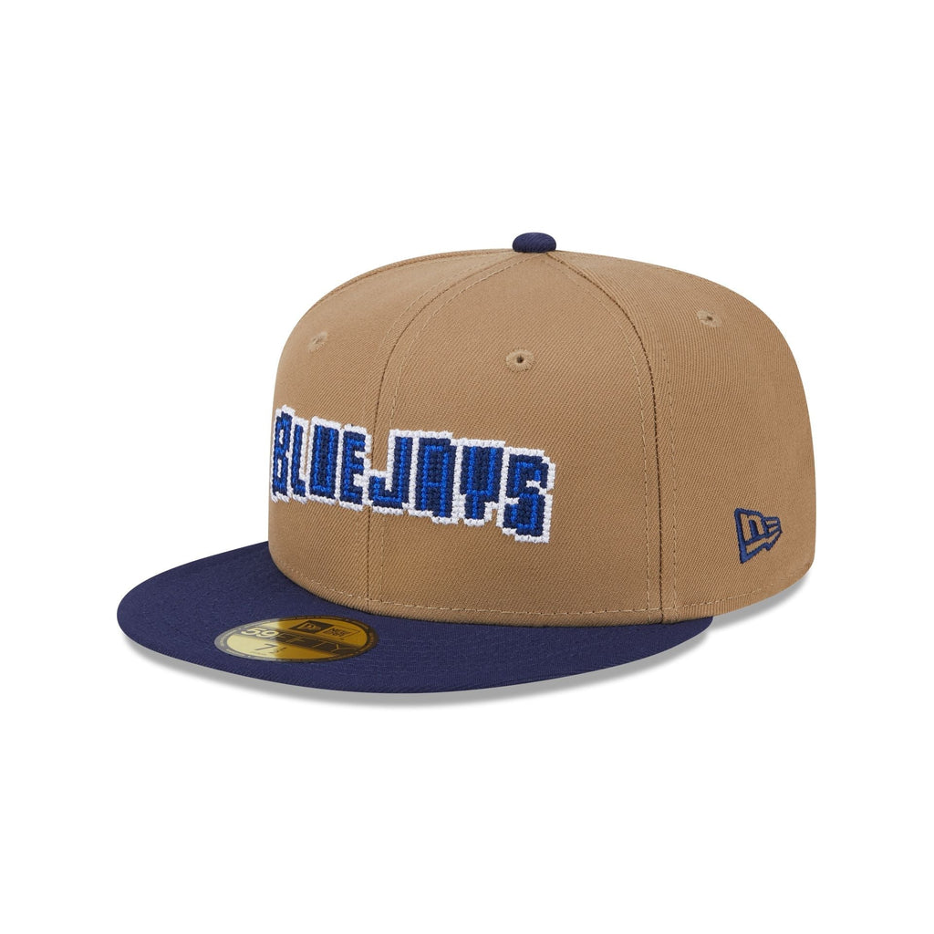 https://cdn.shopify.com/s/files/1/0601/2554/4675/files/60573347_59FIFTY_CLASSIC8-BITWORDMA_TORJAYCO_KHK_3QL.jpg?v=1726173641