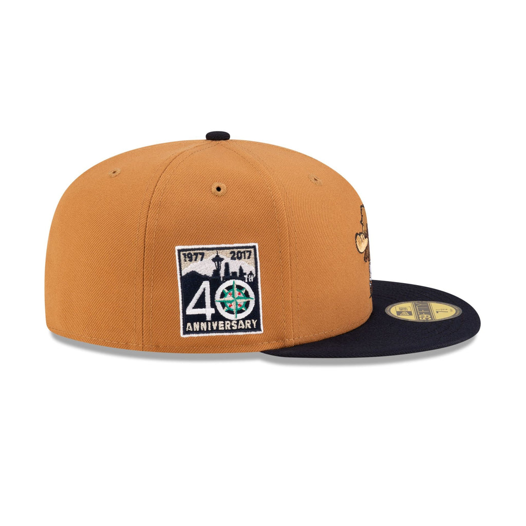 https://cdn.shopify.com/s/files/1/0601/2554/4675/files/70873196_59FIFTY_MLBMINIMASCOT_SEAMARCO_BRN_RSIDE.jpg?v=1719412089